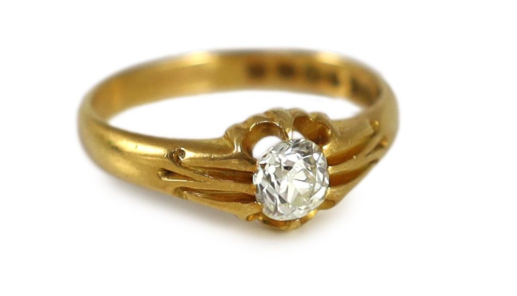 A late Victorian 18ct gold and claw set oval cushion cut diamond set ring